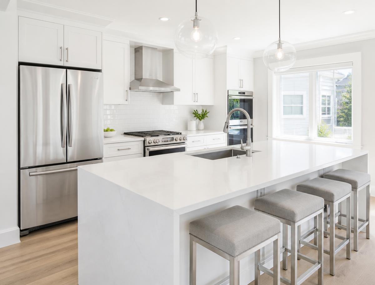 Spotless kitchen counters and appliances after a cleaning visit